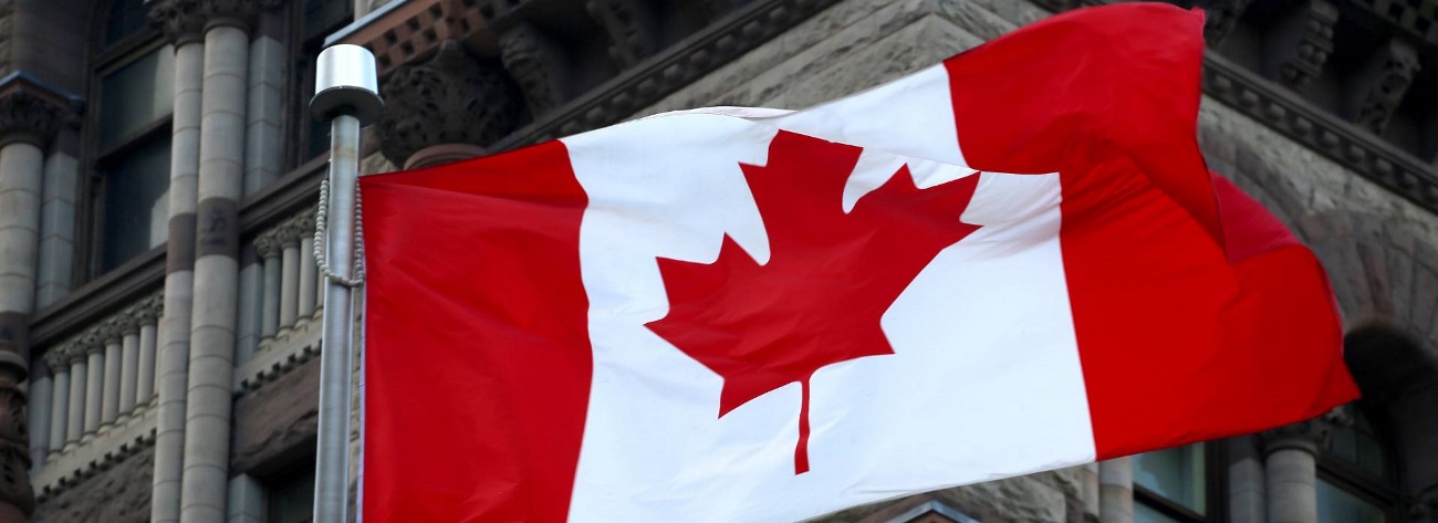 Canadian flag in front of a building - Link to [Webinar Series] Canadian Trademarks 2023