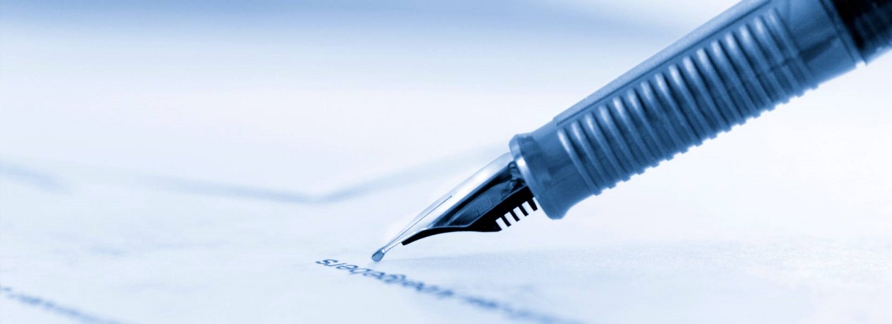 a pen signing a contract